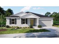 Charming single-story home with a well-manicured lawn and a two-car garage at 22492 Provance Ave, Port Charlotte, FL 33954