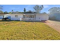 Charming single-story home with white picket fence and well-maintained front lawn at 6440 22Nd S St, St Petersburg, FL 33712