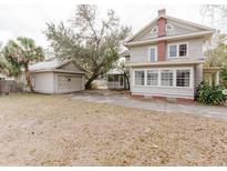 Charming two-story home with a detached garage and a spacious front yard at 8226 36Th N Ave, St Petersburg, FL 33710