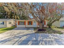 Charming single-story home with a well-maintained front yard and a concrete driveway at 4046 Las Vegas Dr, New Port Richey, FL 34653