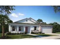 Charming single story home with stone accents, shutters, a two car garage and a beautiful landscaped yard at 2994 Alesio Ave, North Port, FL 34286