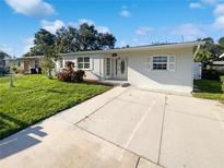 Charming single-story home with well-maintained lawn and inviting front entrance at 4800 86Th N Ave, Pinellas Park, FL 33782