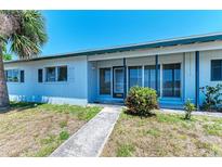 Charming single story home with covered entry and beautifully maintained lawn at 149 Roselle Ct, Port Charlotte, FL 33952