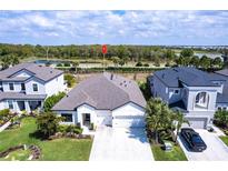 A lovely single-Gathering home with manicured lawn, attached two car garage, and stunning views of nature at 16524 Paynes Mill Dr, Bradenton, FL 34211