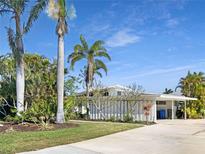 Charming single-story home with mature landscaping and a spacious driveway at 513 Flamingo Dr, Apollo Beach, FL 33572