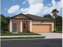 Charming single-story home with a two car garage, manicured lawn, and welcoming front entry at 14725 Italy Ave, Dade City, FL 33523