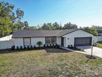 Well maintained single Gathering home featuring a two-car garage and manicured lawn at 4907 21St W Ave, Bradenton, FL 34209