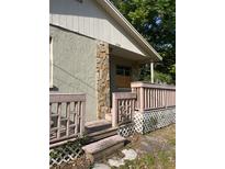 Charming home front entrance featuring decorative stone pillar and covered porch at 2918 E Waters Ave, Tampa, FL 33604