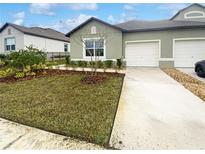 Charming single-Gathering home with a well-manicured lawn and a two-car garage at 6856 Ripple Pond Loop, Zephyrhills, FL 33541