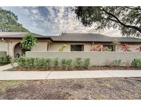 Inviting single-story home with lush landscaping and a well-maintained lawn, providing great curb appeal at 6262 142Nd N Ave # 1203, Clearwater, FL 33760