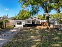 Charming single-story home with lush front lawn and inviting curb appeal, perfect for a starter home at 1121 49Th Ave N, St Petersburg, FL 33703