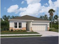 Charming single-story home featuring stone accents, a two-car garage, and a well-manicured lawn at 36157 Canelli Way, Dade City, FL 33523
