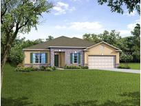 Charming single-story home features stone accents, neutral tones, a well-manicured lawn, and a two car garage at 26170 Mindanao Ln, Punta Gorda, FL 33983