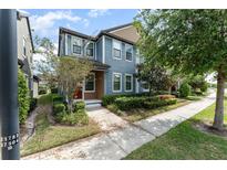 Charming two-story home with blue siding, a landscaped yard, and a welcoming front entrance at 5710 Colony Glen Rd, Lithia, FL 33547