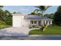 Charming single-story home featuring a two-car garage, tropical landscaping, and neutral tones at 25197 Delgado Dr, Punta Gorda, FL 33955