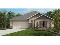 Charming single-story home featuring a two-car garage, manicured lawn, and inviting curb appeal at 6322 Burning Opal Bnd, Land O Lakes, FL 34638