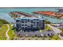 Condominium complex with stunning waterfront views, ample parking, and easy access to the sparkling blue water at 1581 Gulf Blvd # 102N, Clearwater Beach, FL 33767