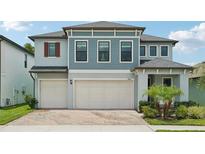 Charming two-story home with a three-car garage and well-maintained landscaping at 8364 Capstone Ranch Dr, New Port Richey, FL 34655