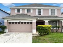 Charming two-story home featuring a two-car garage and well-maintained landscaping in a suburban setting at 2007 Rain Dance Pl, Brandon, FL 33510