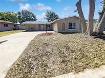Charming single-story home with a well-manicured lawn and inviting curb appeal, ready for its new owners at 10454 138Th St, Largo, FL 33774