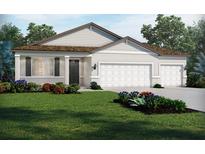 Charming single-story home with a manicured lawn and a two car garage at 1787 Draughton Dr, Zephyrhills, FL 33541