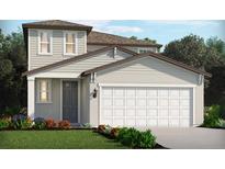 Charming two-story home with a gray door, two-car garage, and well-manicured lawn at 437 Lazy Shore Dr, Nokomis, FL 34275