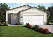Charming single-story home with a manicured lawn and colorful flower beds, offering great curb appeal at 441 Lazy Shore Dr, Nokomis, FL 34275