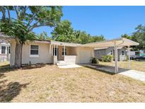 Charming single-story home featuring a covered carport and well-maintained front yard at 626 Belleview Blvd, Clearwater, FL 33756