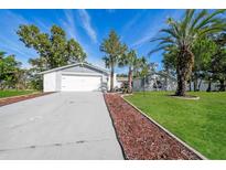 Charming single-story home boasts a well-maintained yard and an attached two-car garage at 10237 Bannock St, Spring Hill, FL 34608