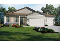 Charming single-story home featuring a two-car garage, well-manicured lawn, and colorful landscaping at 13839 Richland Gulf Cir, Parrish, FL 34219