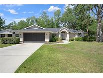 Charming single-story home boasts a well-manicured lawn and inviting curb appeal at 621 Erin Way, Brooksville, FL 34601