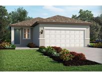 Charming single-story home featuring a two-car garage, neutral paint, and a well-maintained front yard at 14118 Crutchfield Ct, Parrish, FL 34219