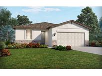 Charming one-story home with a two-car garage, lush lawn, and beautiful landscaping at 193 Lazy Shore Dr, Nokomis, FL 34275