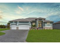 Charming single-story home featuring a 3-car garage, stone accents, and manicured lawn at 209 Rotonda S Blvd, Rotonda West, FL 33947