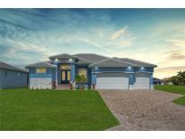 Charming single-story home with a three-car garage, lush lawn, and inviting curb appeal at 223 Rotonda S Blvd, Rotonda West, FL 33947