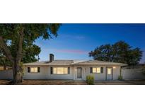 Charming single-story home with a well-maintained lawn and a metal roof at 5817 26Th W St, Bradenton, FL 34207