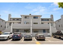 Two-story condominium complex featuring private parking and a charming gray exterior at 5744 Calais N Blvd # 4, St Petersburg, FL 33714