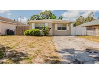 Charming single-story home with a well-lit exterior and a neatly maintained front yard at 4010 Emerson S Ave, St Petersburg, FL 33711