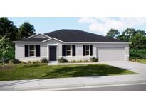 Traditional home featuring professional landscaping, a two-car garage, and neutral colors at 25416 Jubal St, Punta Gorda, FL 33955