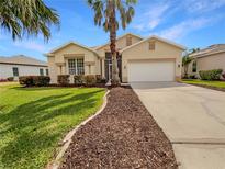 Charming single-story home with a well-manicured lawn and a spacious two-car garage at 5154 51St W Ln, Bradenton, FL 34210