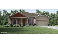 Charming single-story home with stone accents, a two-car garage, and a well-manicured lawn at 2185 Sulstone Dr, Punta Gorda, FL 33983