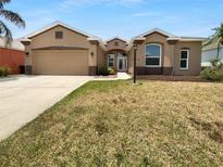 Charming single-story home boasts a well-manicured lawn, attached garage, and inviting curb appeal at 6370 Sturbridge Ct, Sarasota, FL 34238