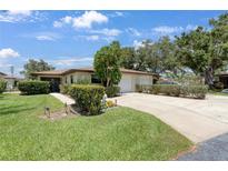Charming single-story home with a well-manicured lawn and two-car garage at 6108 Penny Ln # 0, Bradenton, FL 34207