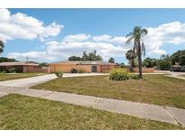 Lovely single-story home with a well-maintained front yard and a long driveway at 1301 Lucaya Ave, Venice, FL 34285