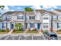 Charming townhomes with blue shutters and well-maintained landscaping offering curb appeal at 10429 Heron Lake Dr, Riverview, FL 33578