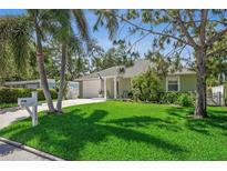 Charming home with a well-manicured front lawn and welcoming curb appeal and an inviting driveway at 3404 W Villa Rosa St, Tampa, FL 33611