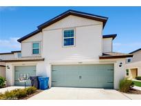 Charming two-story townhome featuring a two-car garage and a well-maintained lawn at 5329 Companion Ln, Tampa, FL 33619