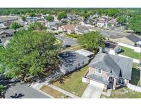 An aerial view of a cozy neighborhood with well-maintained lawns and varied home styles at 4601 Copper Ln, Plant City, FL 33566