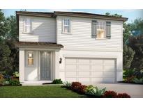 Charming two-story home featuring a gray door, white siding, and an attached two-car garage at 1855 Brekey Way, Zephyrhills, FL 33541