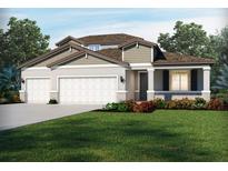 Charming single-Gathering home with a manicured lawn, a two car garage and inviting covered entryway at 1763 Draughton Dr, Zephyrhills, FL 33541